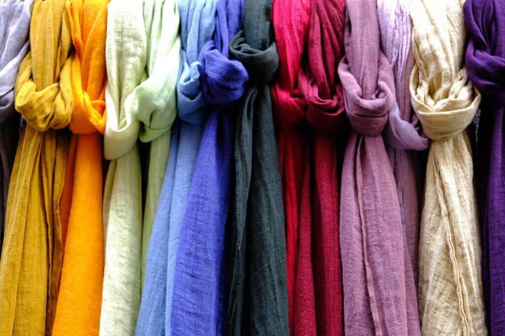 Multiple scarves of different colors.