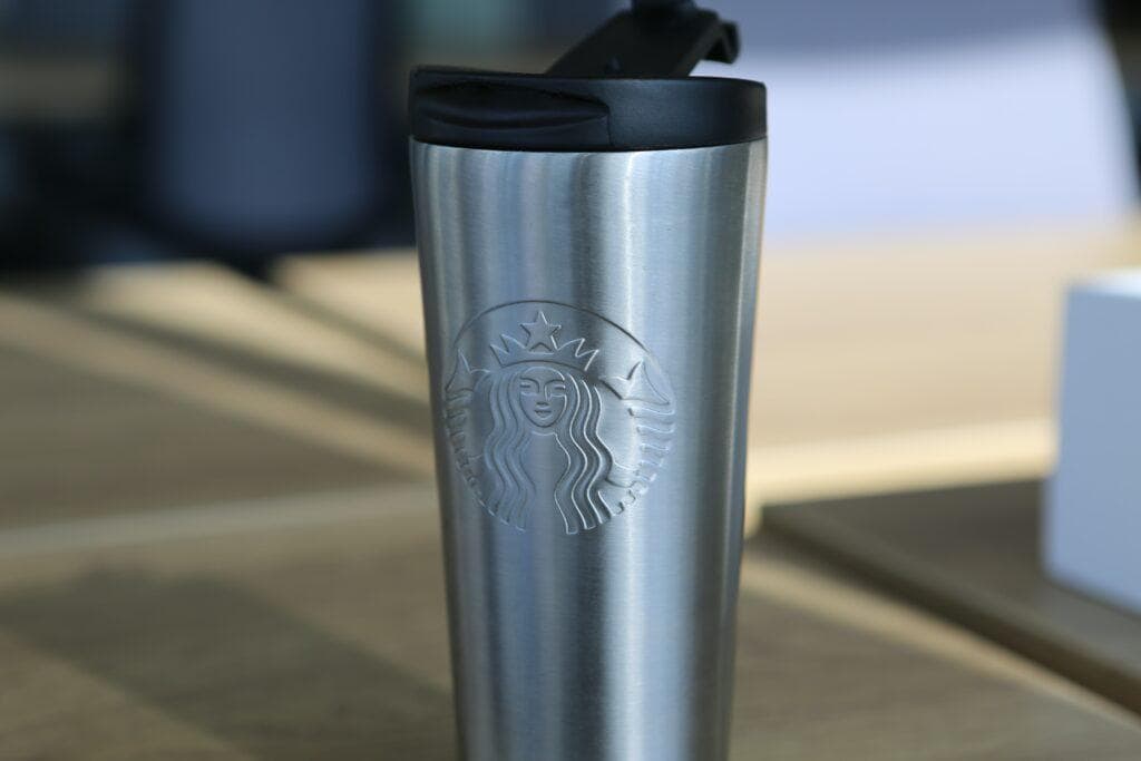 silver Starbucks reusable coffee mug