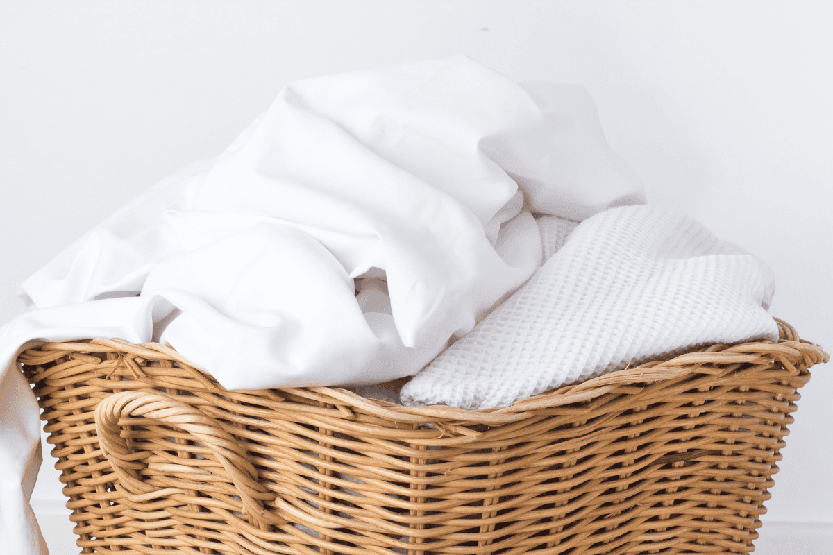 woven basket holding white linens